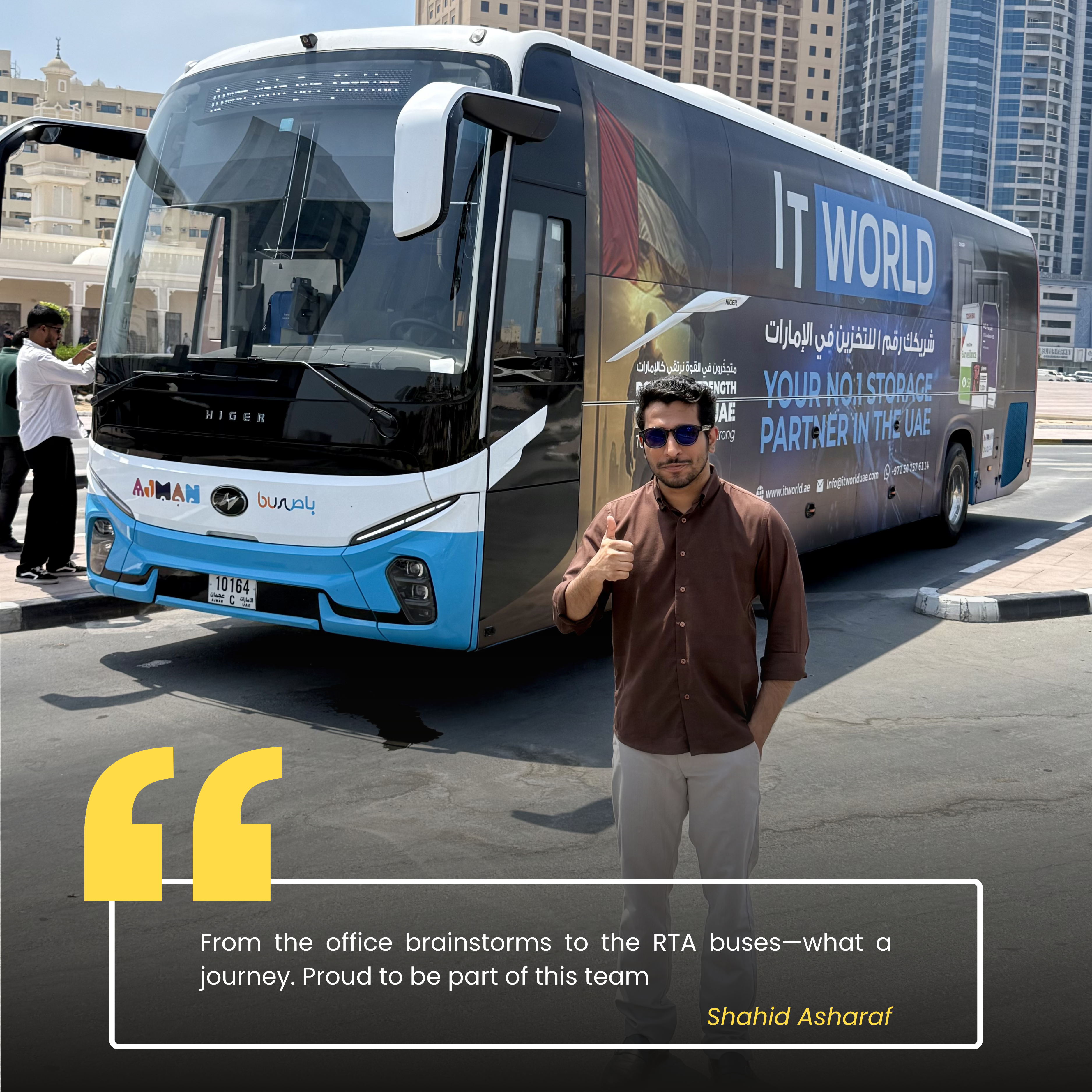 Shahid — IT World Trading team member, photographed beside the RTA campaign bus